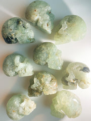 The Crystal Reserve 2" Prehnite & Epidote Skulls crystal healing crystal skulls crystal carvings prehnite skulls