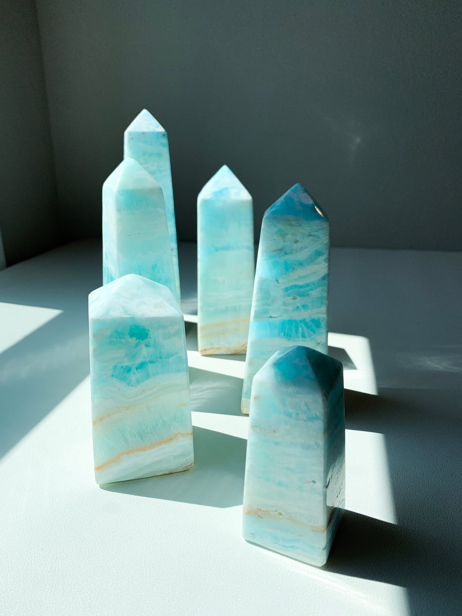 The Crystal Reserve Healing Crystals Los Angeles This extremely popular new mineral was recently found in 2019 in Pakistan, and TCR is bringing you the best quality to come from their mines!  Caribbean Blue Calcite activates your mind and are super soothing to the emotions. They help in unblocking the third eye and are said to stimulate one's intuitive and psychic abilities. It can also work as a natural sedative after emotional trauma.  Hardness: 2.5-3 Vibration Number: 8